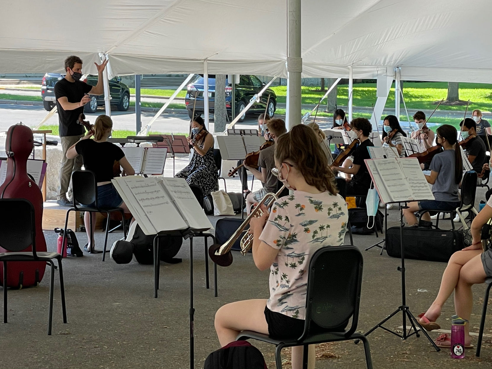 Kyle Knox conducting in tent